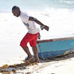 Man pulling boat