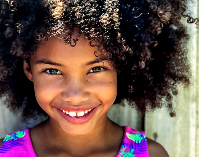 Little brown girl with big curly hair