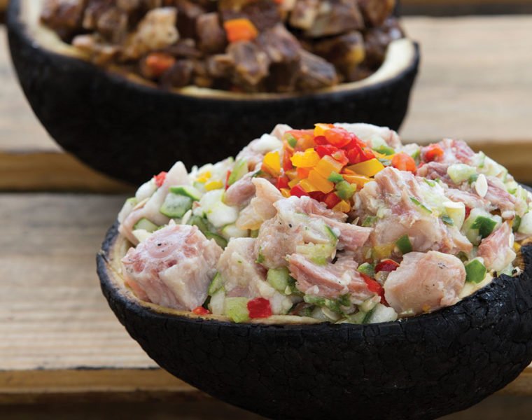 roasted breadfruit with pig tails and pickled cucumber