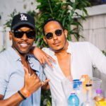 Two men posing at party